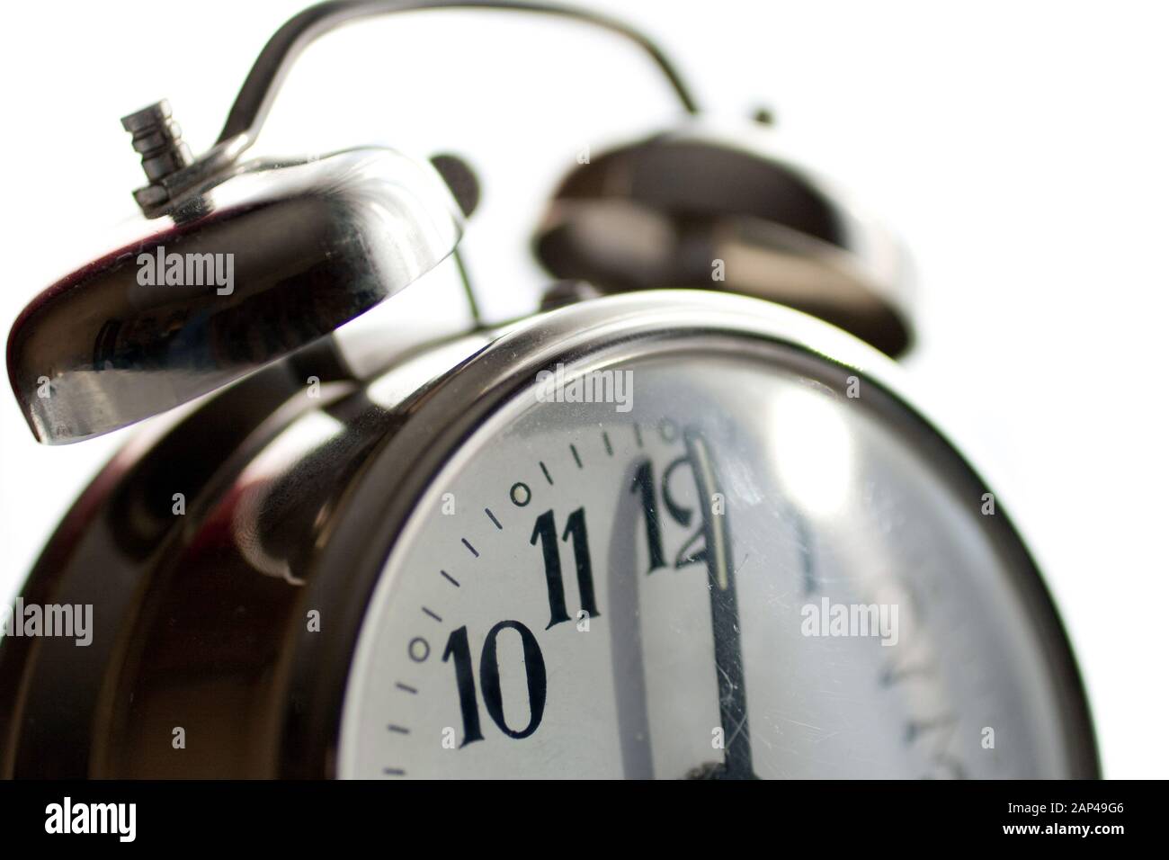 Vintage alarm clock isolated on white background Stock Photo - Alamy