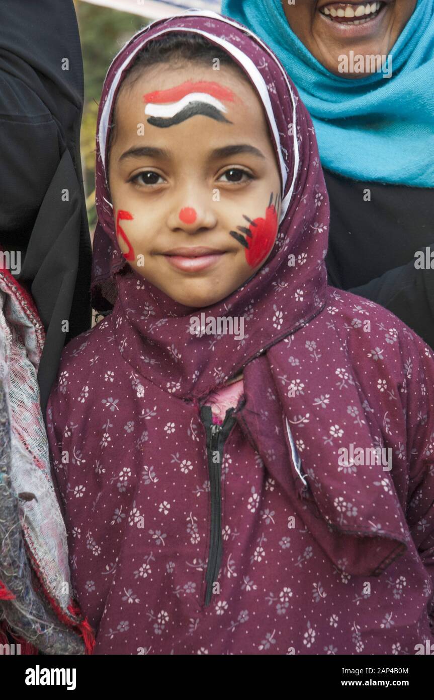 People of Cairo, Egypt: A young girl with face painted in the national colours, at Eid al Adha celebrations Stock Photo