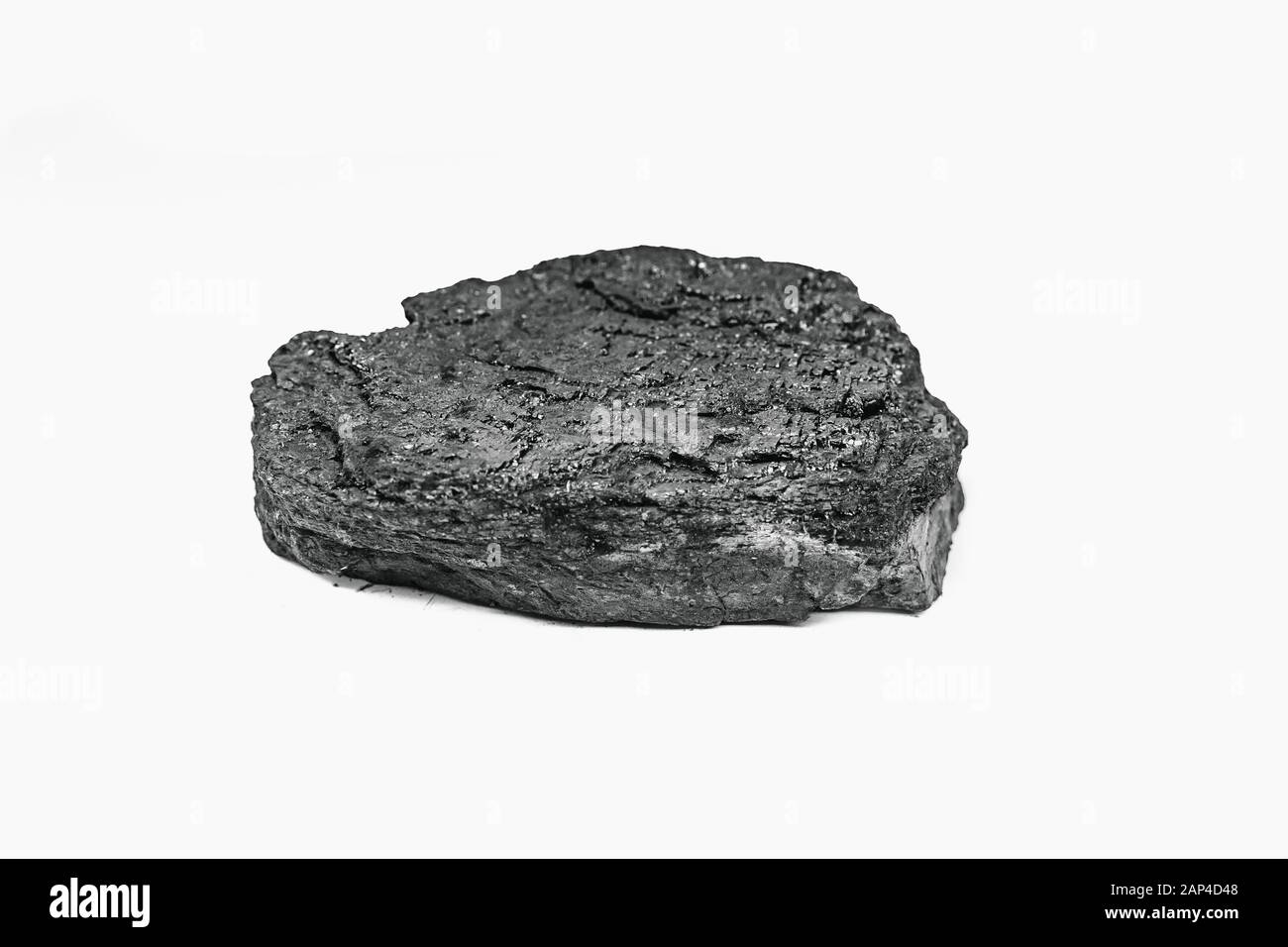 Pieces black coal lie on white isolated background, copy space Stock Photo