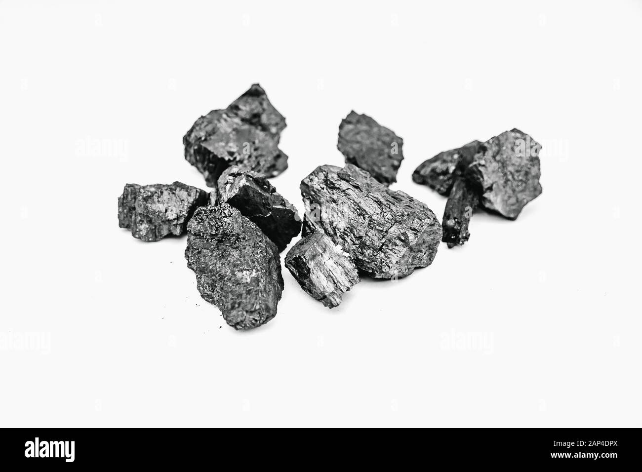 Pieces black coal lie on white isolated background, copy space Stock Photo