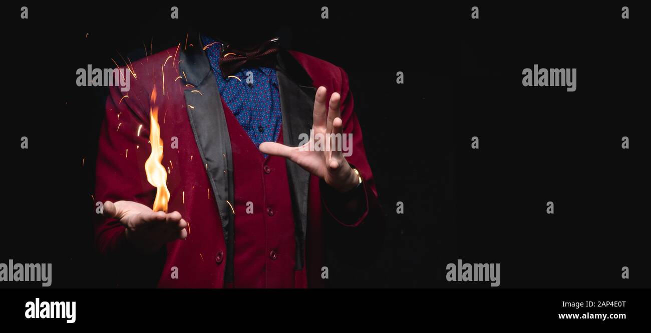 Magician shows trick with fire burn from palms hands Stock Photo Alamy