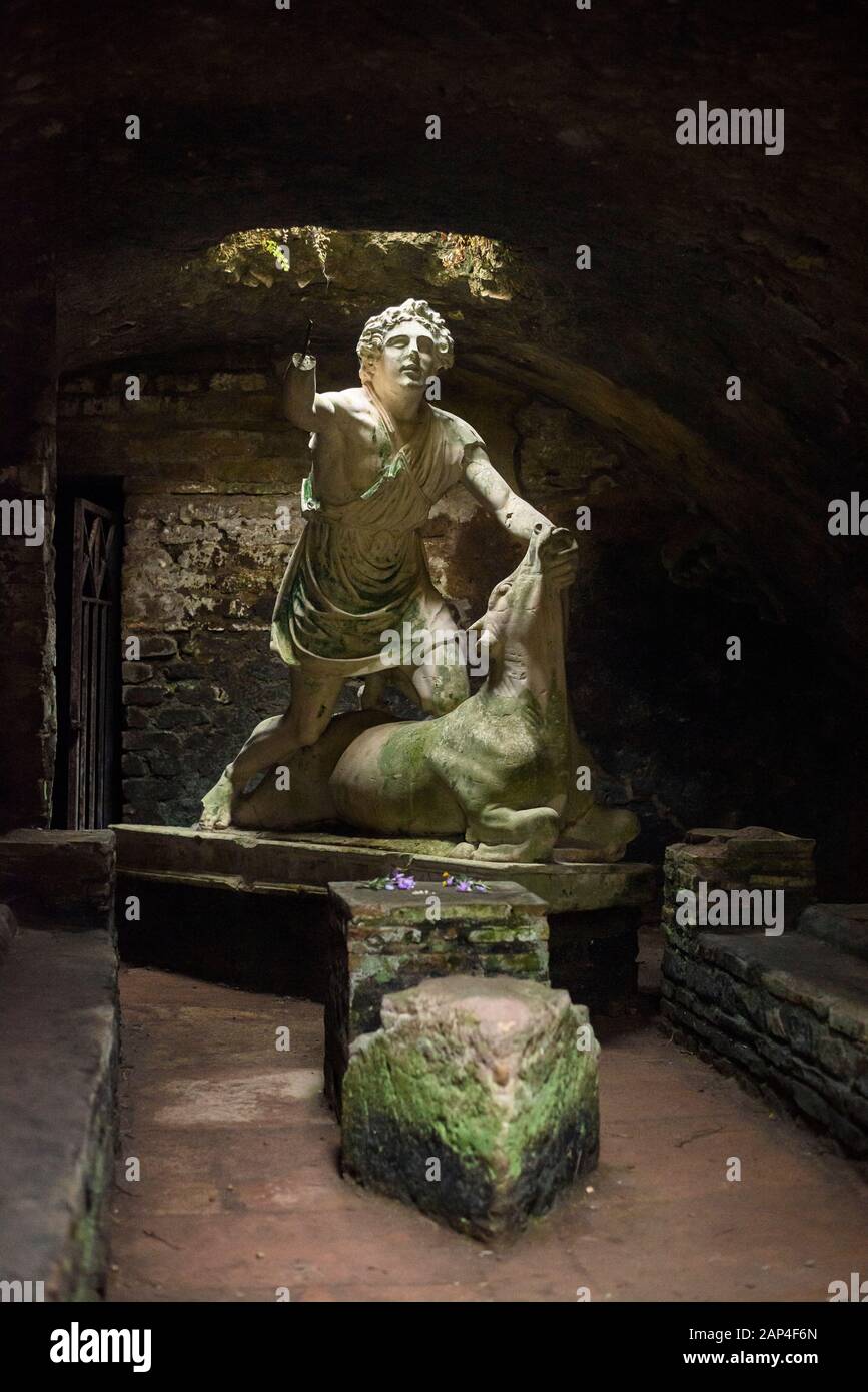 Rome. Italy. Ostia Antica. Mithraeum of the Baths of Mithras (Mitreo delle Terme del Mitra). Mithras about to kill the bull, cast of the original 1st Stock Photo