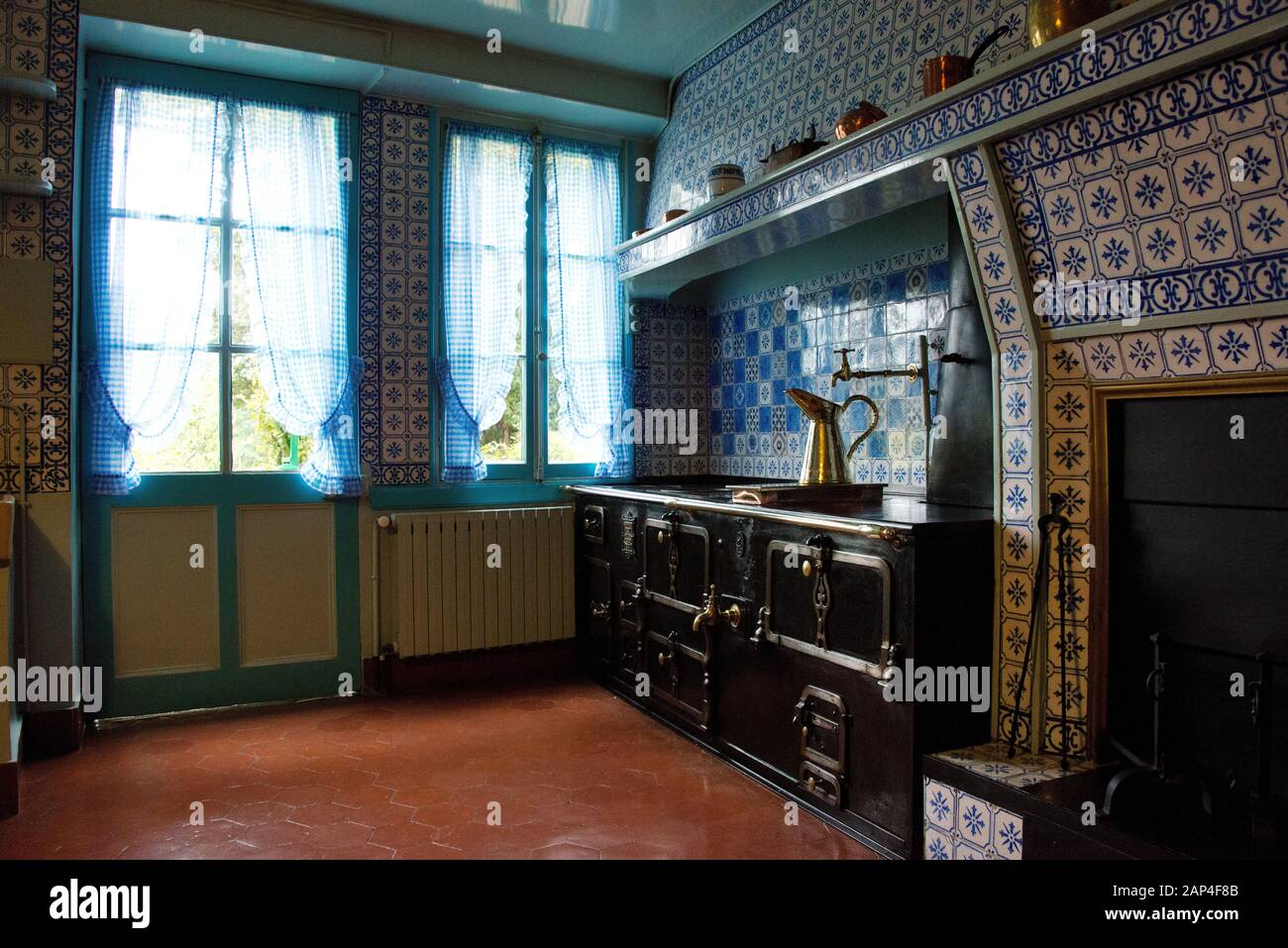 Claude Monet House Giverny Normandy France. Kitchen  area of House 84 Rue Claude Monet Giverny.  Monet House sowing cooking range Stock Photo