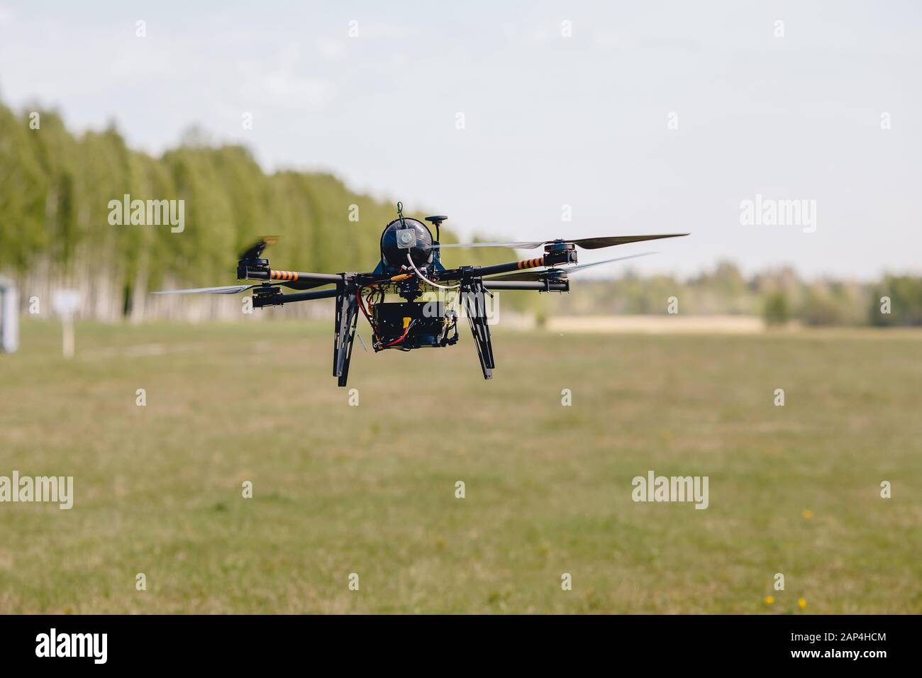 Military hybrid drone aerial test runs on hydrogen to detect people and put out fires Stock Photo