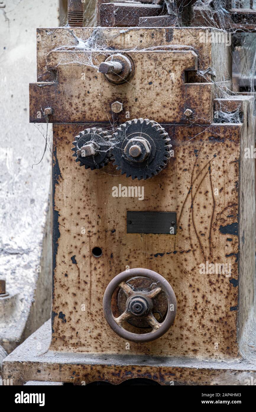 Abandoned industrial equipment covered in cobwebs and rust Stock Photo