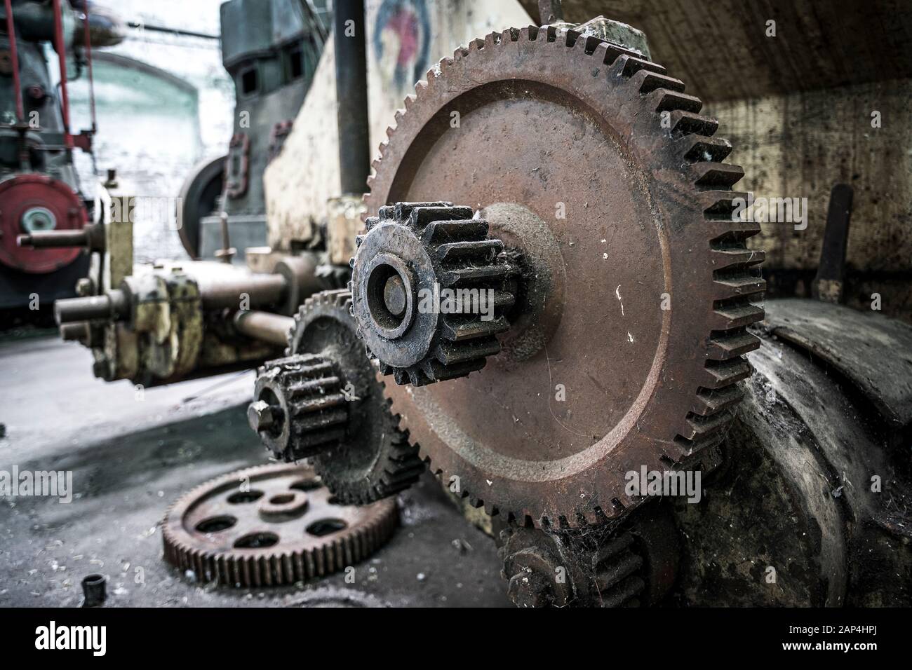 Rusting cogs and machinery at abandoned factory Stock Photo