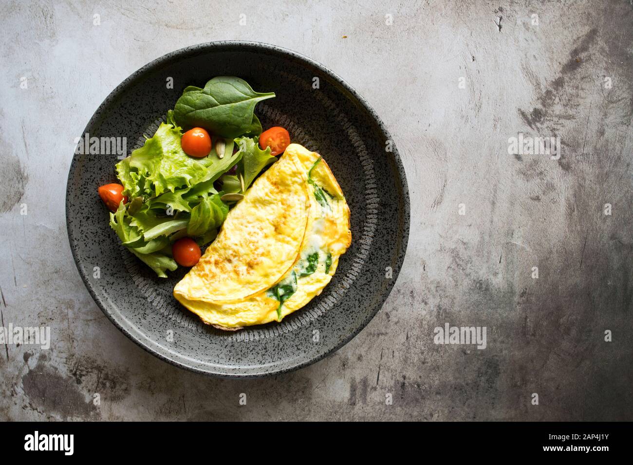 Spinach Omelet with a Mixed Green Salad Stock Photo Alamy