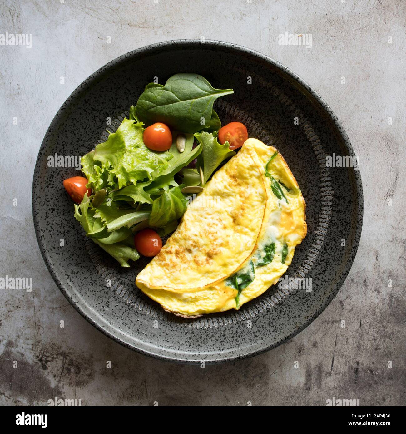 Spinach Omelet with a Mixed Green Salad Stock Photo Alamy