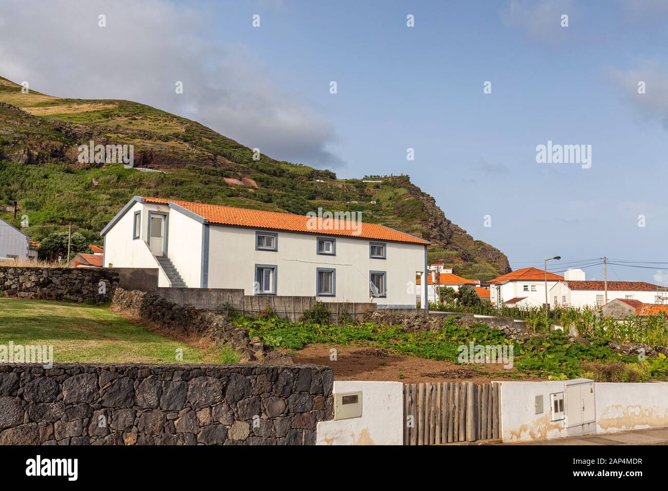 White painted houses from the street in Vila do Corvo on the island of