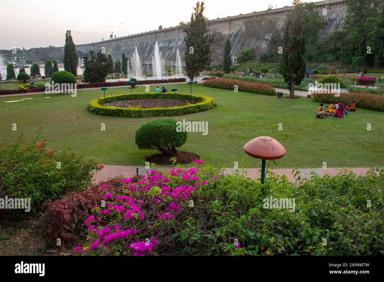 Mysore, Karnataka / India - January 01 2020: Beautiful landscaped garden with water fountains in Brindavan Gardens during sunset with KRS dam in backg Stock Photo