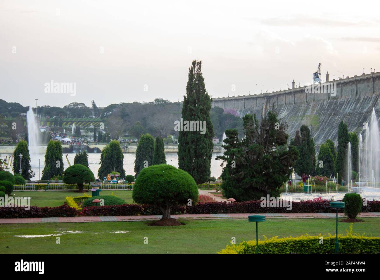 Mysore, Karnataka / India - January 01 2020: Beautiful landscaped garden with water fountains in Brindavan Gardens during sunset with KRS dam in backg Stock Photo