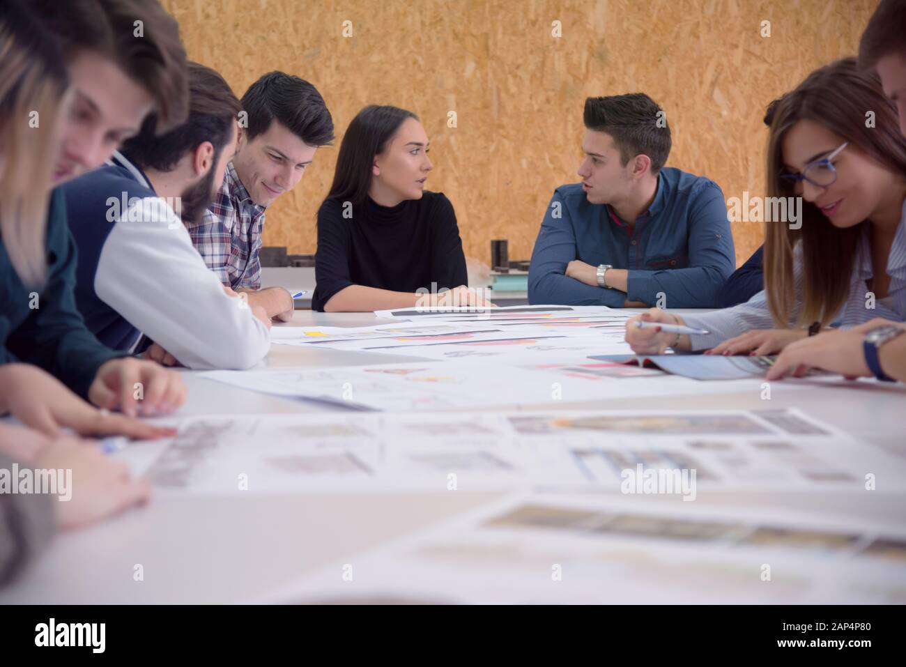 Group of  university architecture students working on practice lessons. Looking for solution during class. Stock Photo