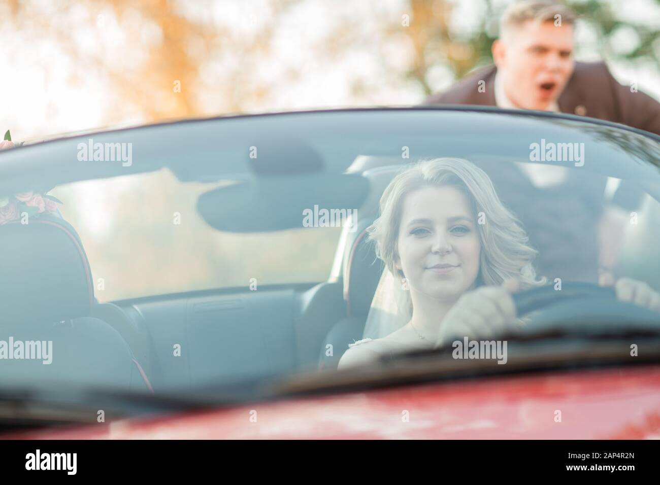 Man woman behind the wheel hi-res stock photography and images - Alamy