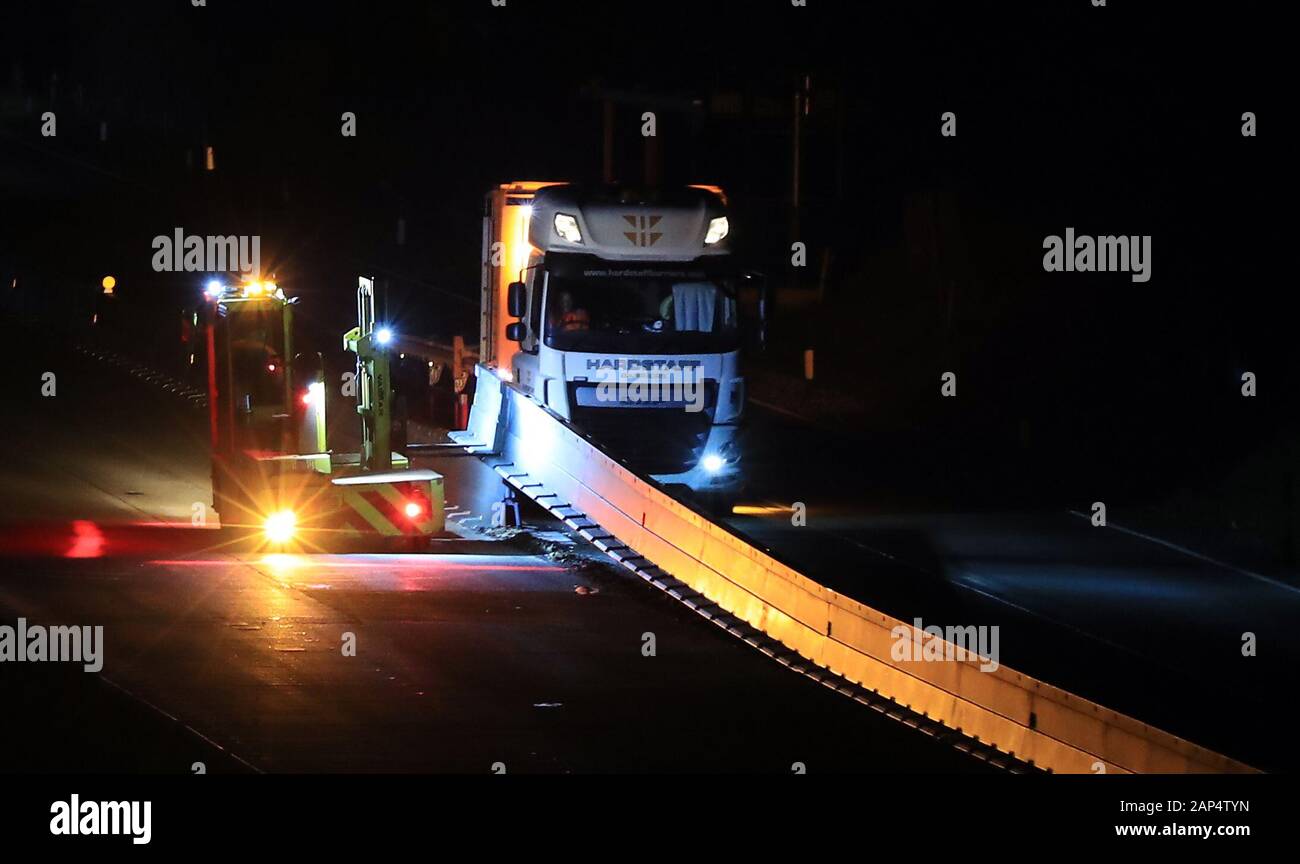 General view of the M20 Motorway near Ashford, Kent, during overnight work to remove the steel barrier which was part of Operation Brock, a £30 million contra-flow system which formed part of the governments no deal Brexit preparations and has been in place for 11 months. Stock Photo