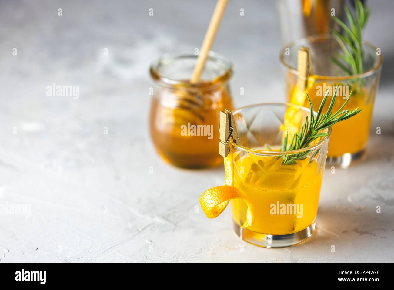Honey bourbon cocktail with rosemary simple syrup or homemade whiskey