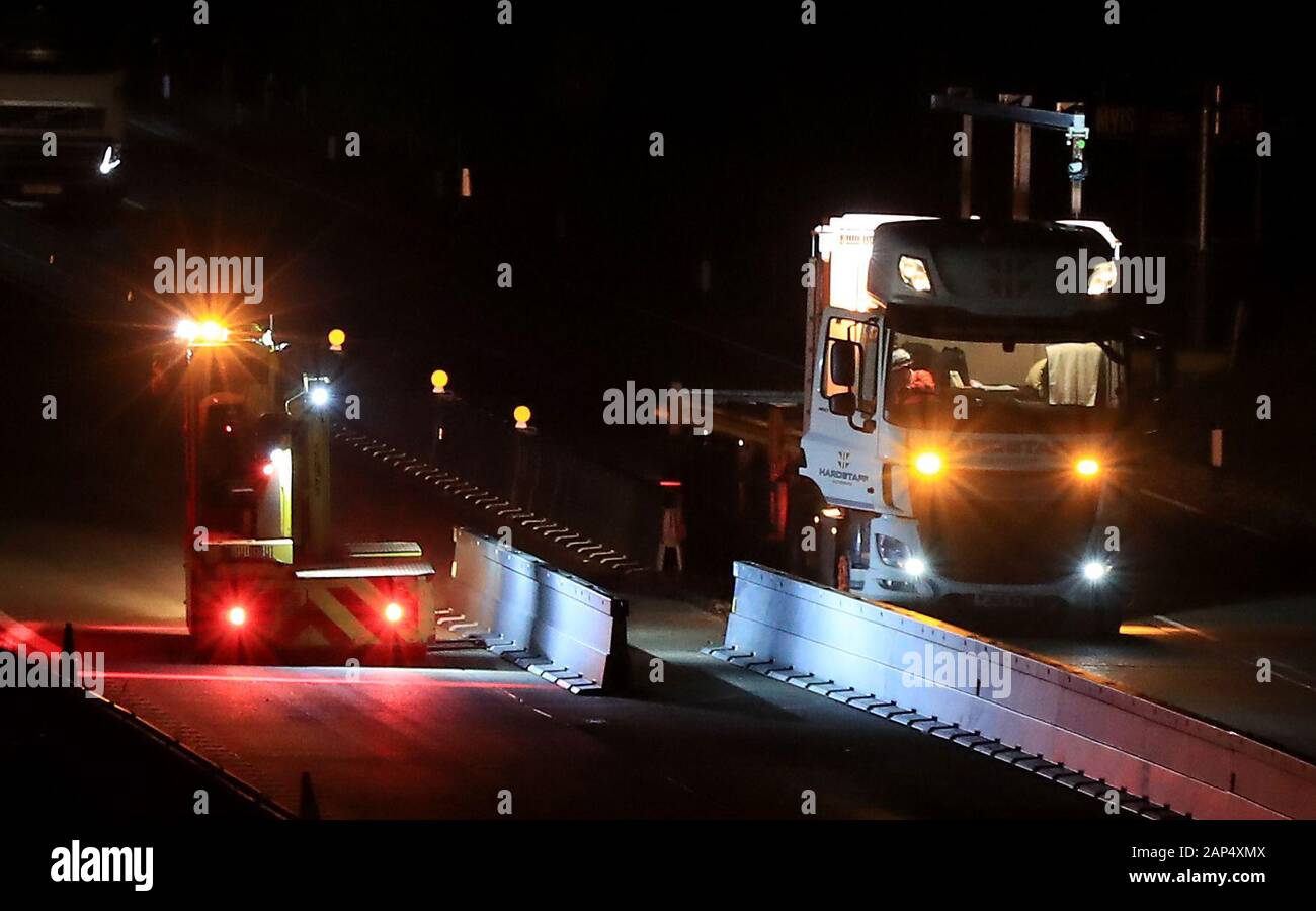 General view of the M20 Motorway near Ashford, Kent, during overnight work to remove the steel barrier which was part of Operation Brock, a £30 million contra-flow system which formed part of the governments no deal Brexit preparations and has been in place for 11 months. Stock Photo