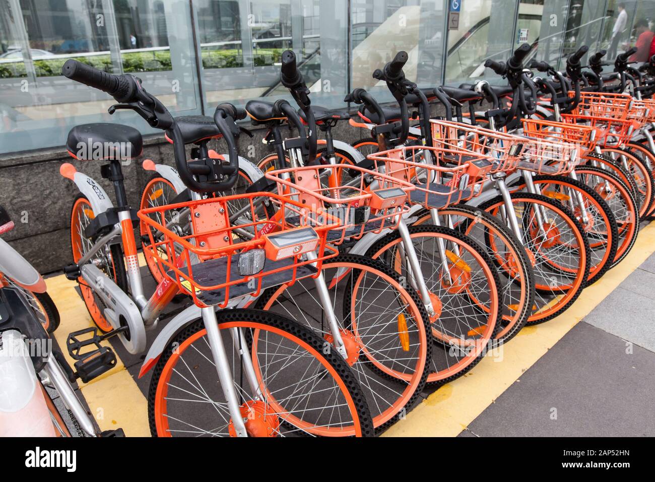 Mobike brand is a bicycle sharing program in Singapore. Tourists can use the bicycle service to tour around the city with a relax pace. Stock Photo