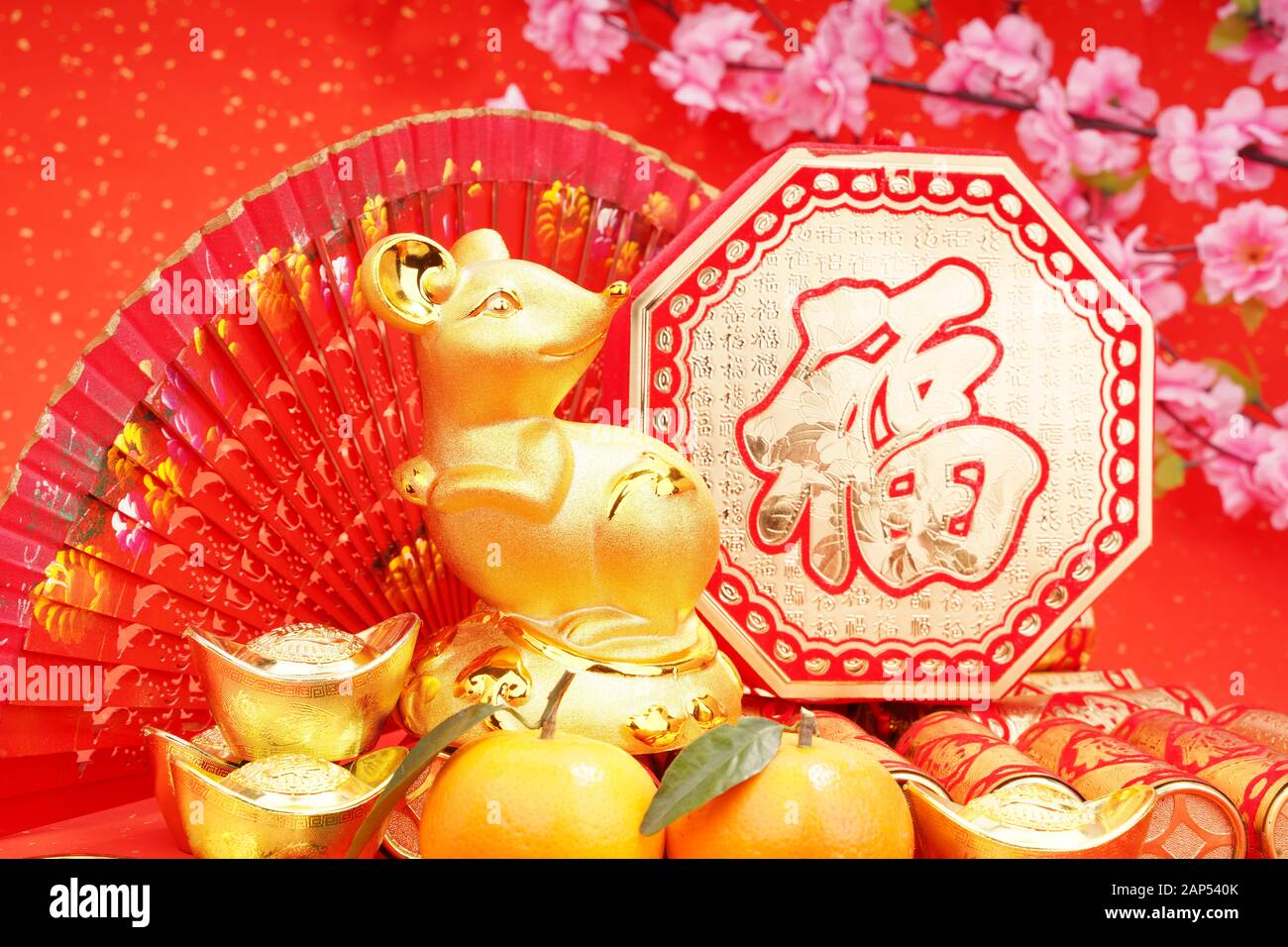 Tradition Chinese golden rat statue rat,2020 is year of the rat,Chinese characters on gold ingot translation: good bless for money. Stock Photo