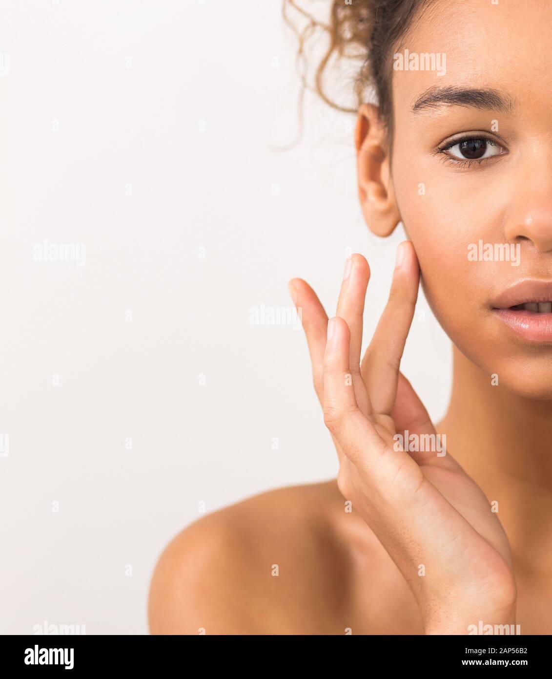 Face lifting concept. Woman touching soft skin on her cheek Stock Photo ...