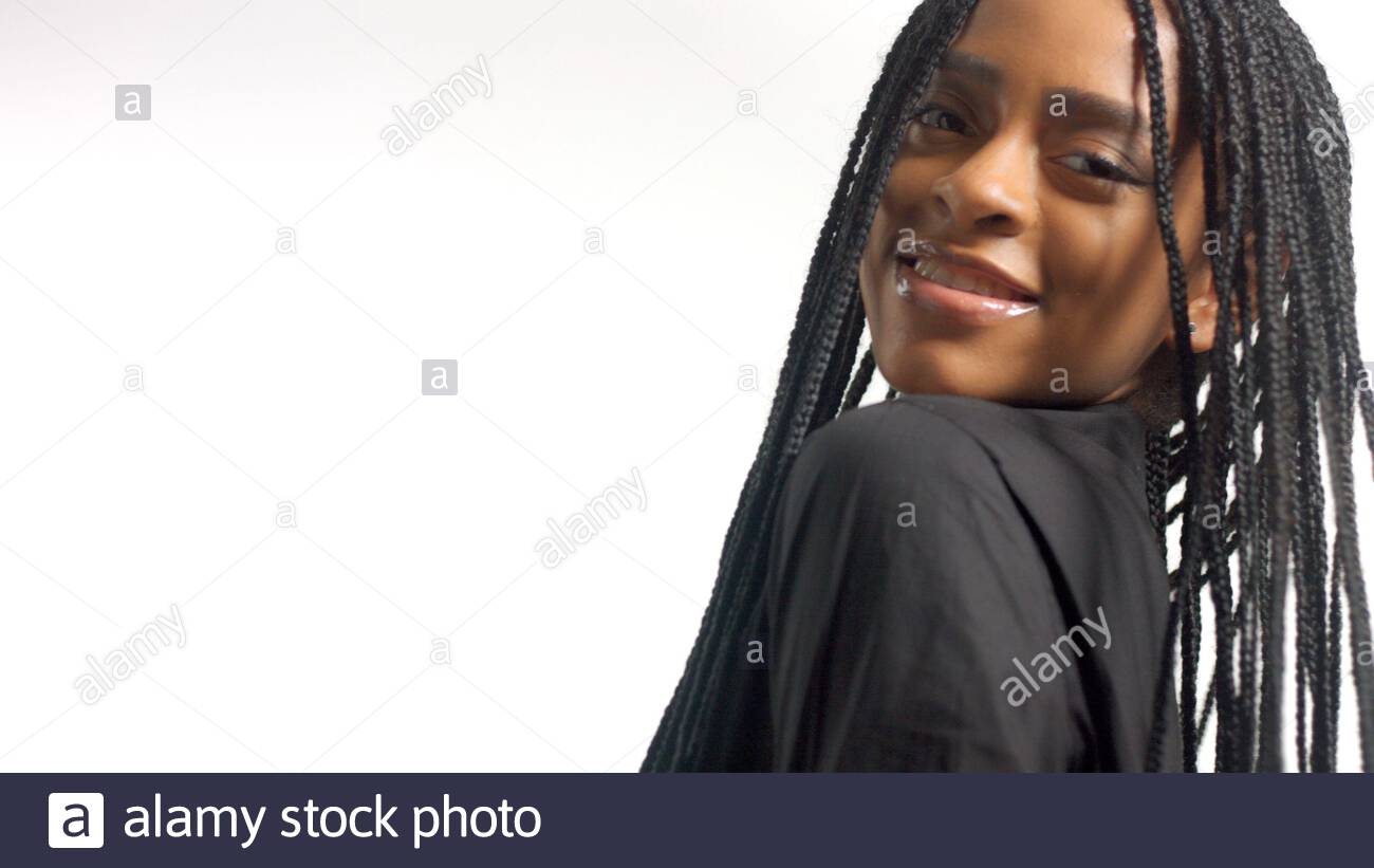 Portrait Of Mixed Race Black Woman With Hair Braids Turns Too The