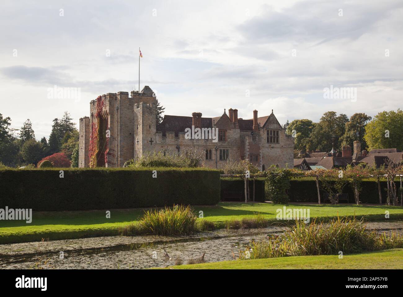 Hever Castle, the Former Home of the Boleyn Family, Behind Hedges and Garden Plants, in the Village of Hever, Kent, United Kingdom Stock Photo