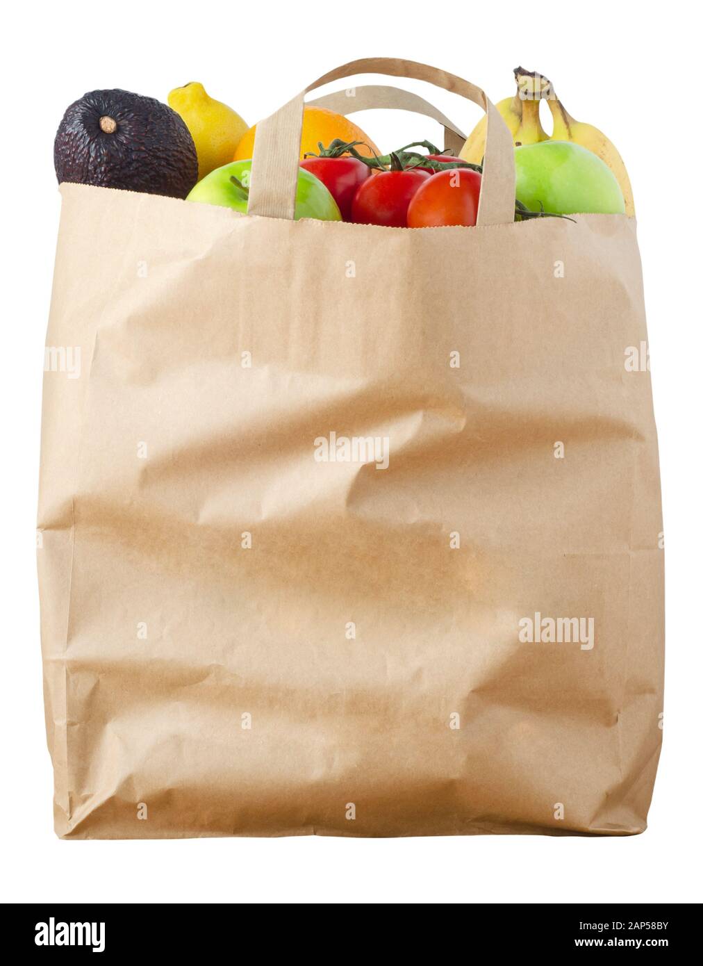 A brown paper shopping bag, filled to the top with varieties of fruit, cut out and isolated on a white background. Stock Photo