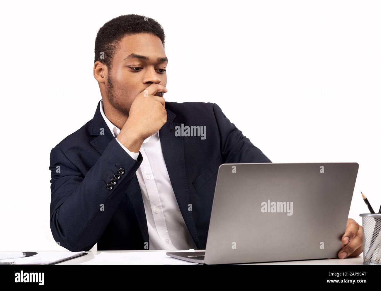 Black guy working on his laptop at office Stock Photo