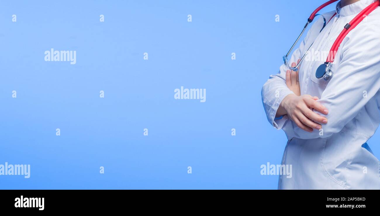 Female Doctor With Stethoscope in blue background Stock Photo - Alamy