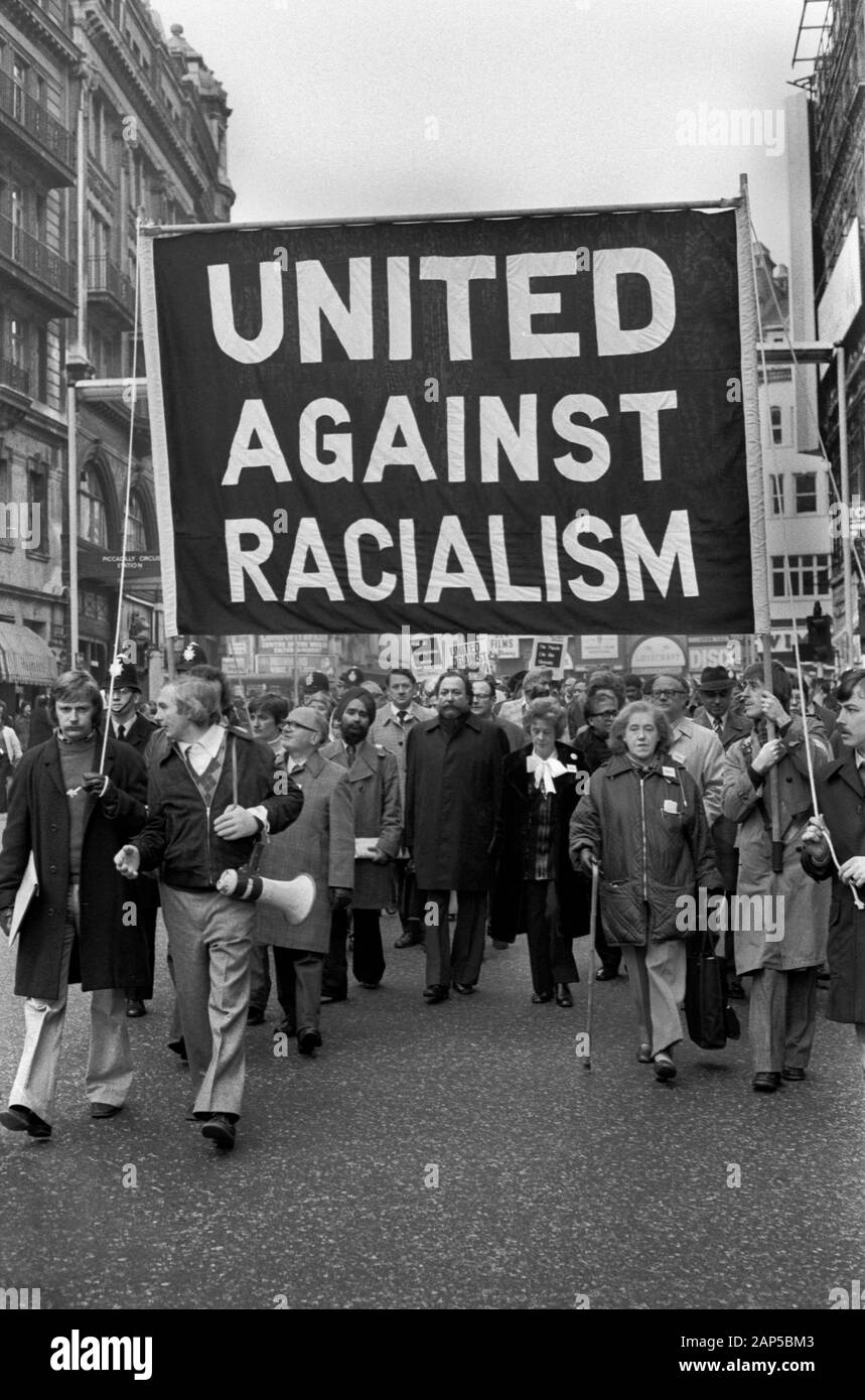 Racism 1970s London UK. United Against Racialism Labour Party and TUC rally and march Trafalgar Square 1976 England. Tom Jackson, General Secretary of the Union of Post Office Workers, (centre under 'A' ) and Barbara Castle Labour MP to his left. HOMER SYKES Stock Photo