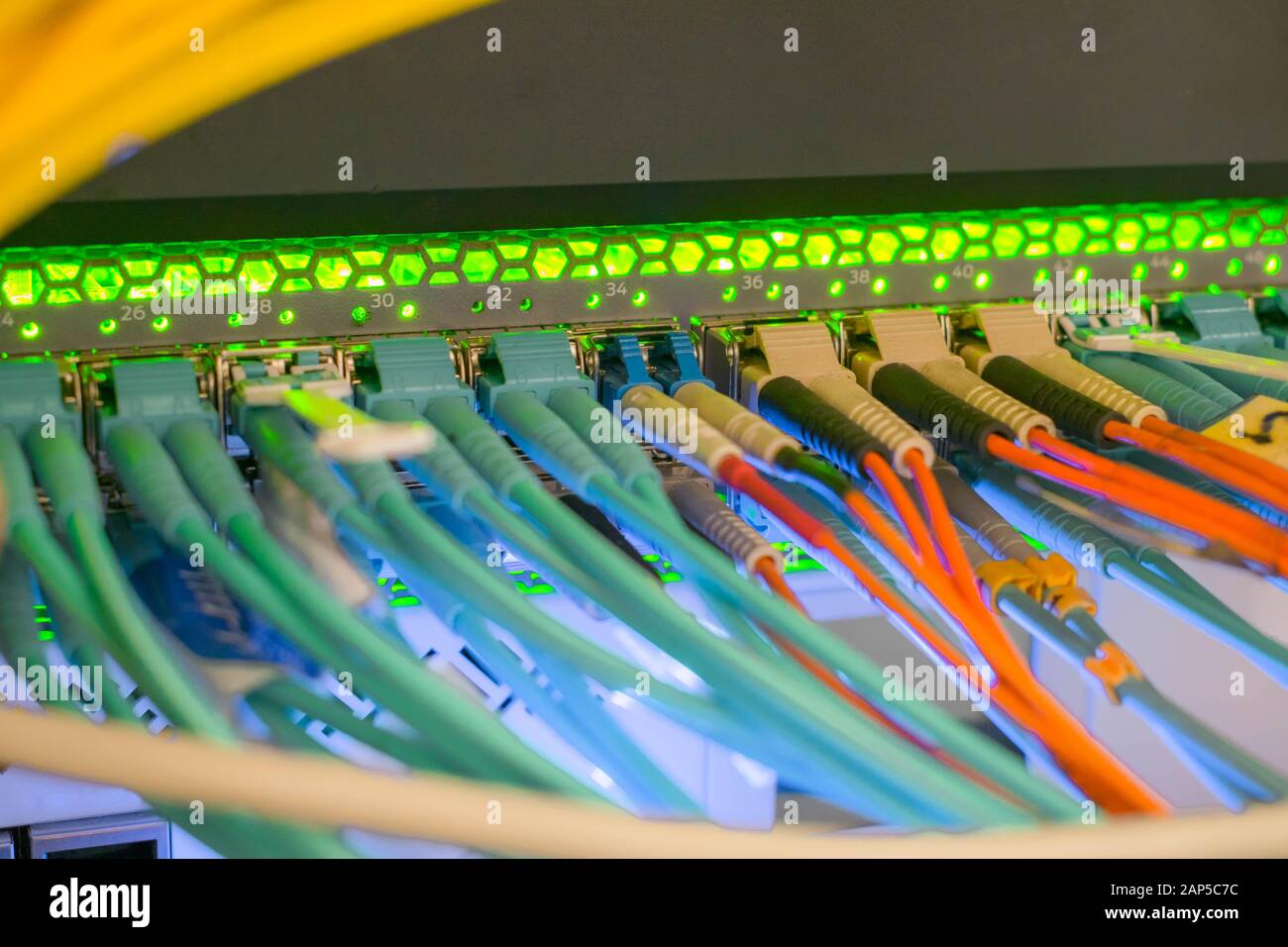 Many fiber optic cables connect to the central router interfaces ...