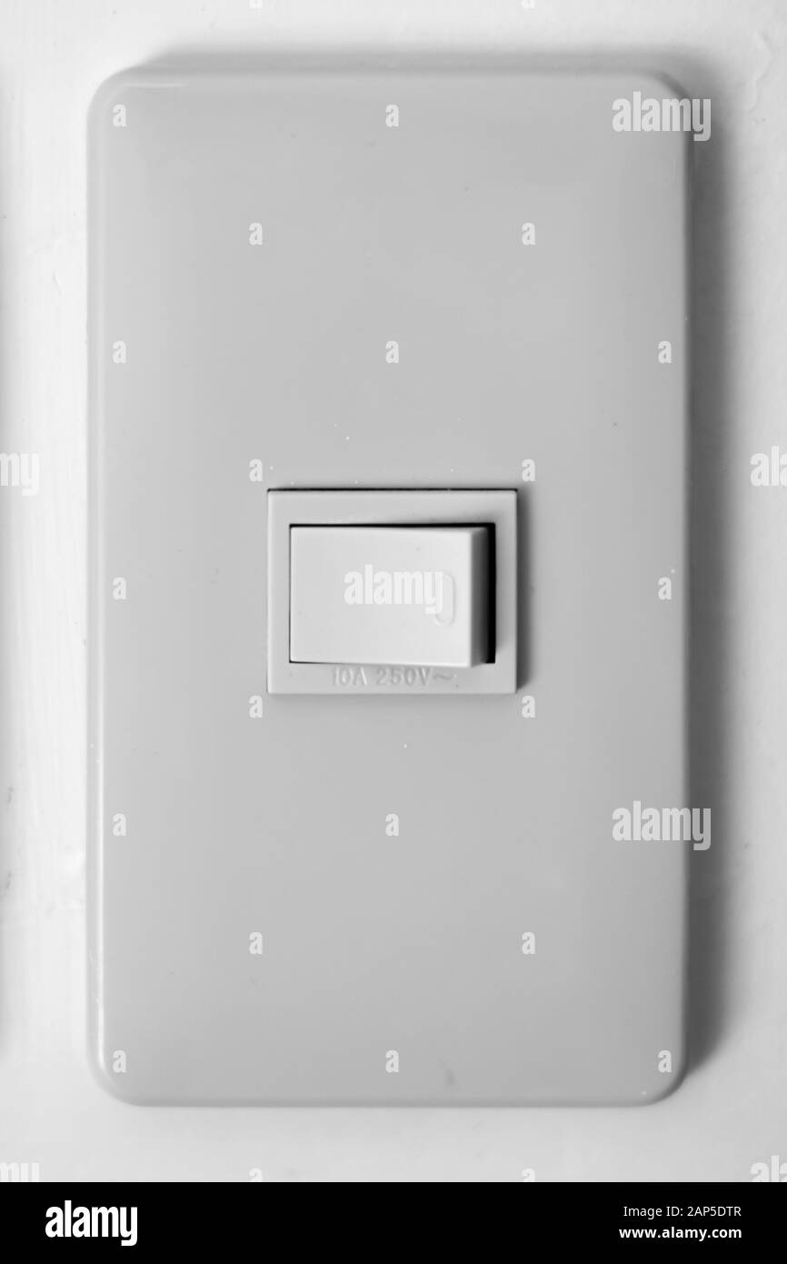 Light switch on a wall in the philippines Stock Photo