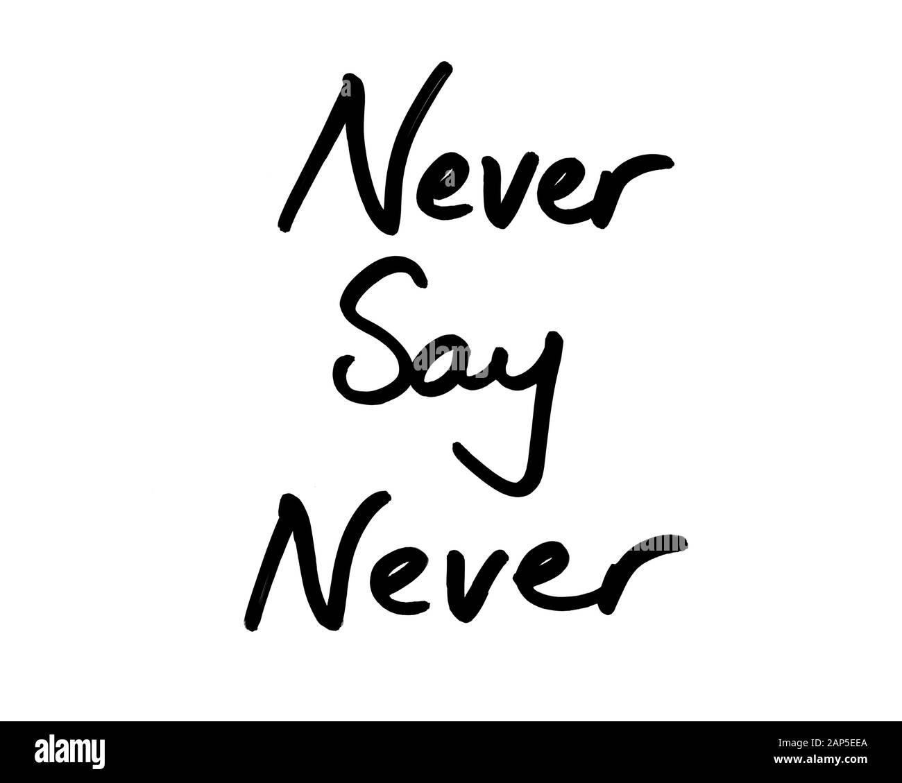 Never Say Never handwritten on a white background. Stock Photo