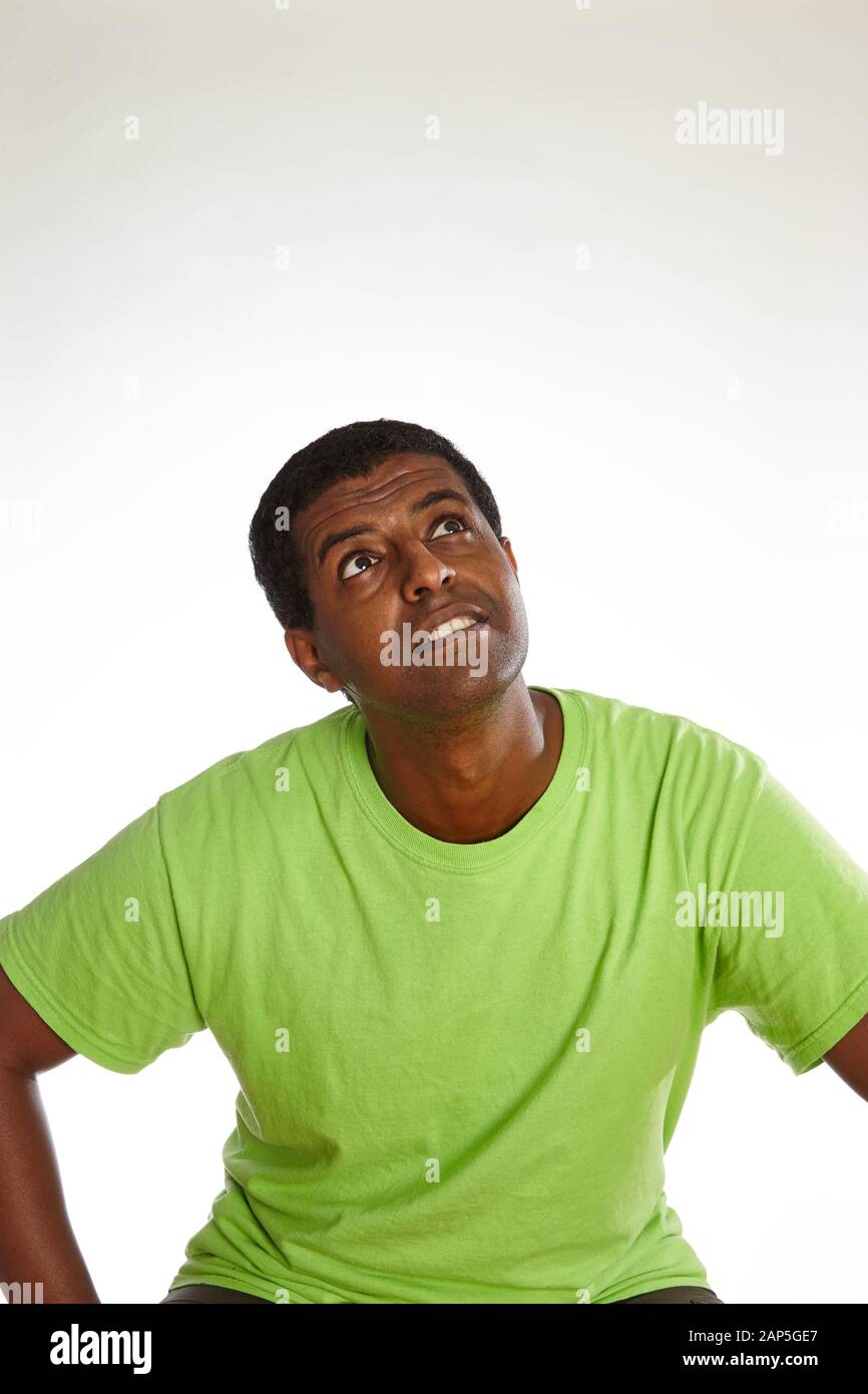 Black man nervously looking up Stock Photo