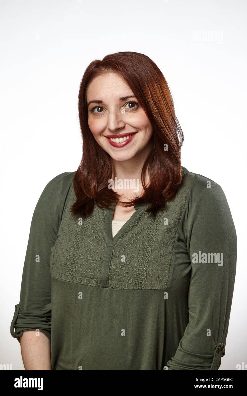 Redhead in green shirt with goofy face Stock Photo
