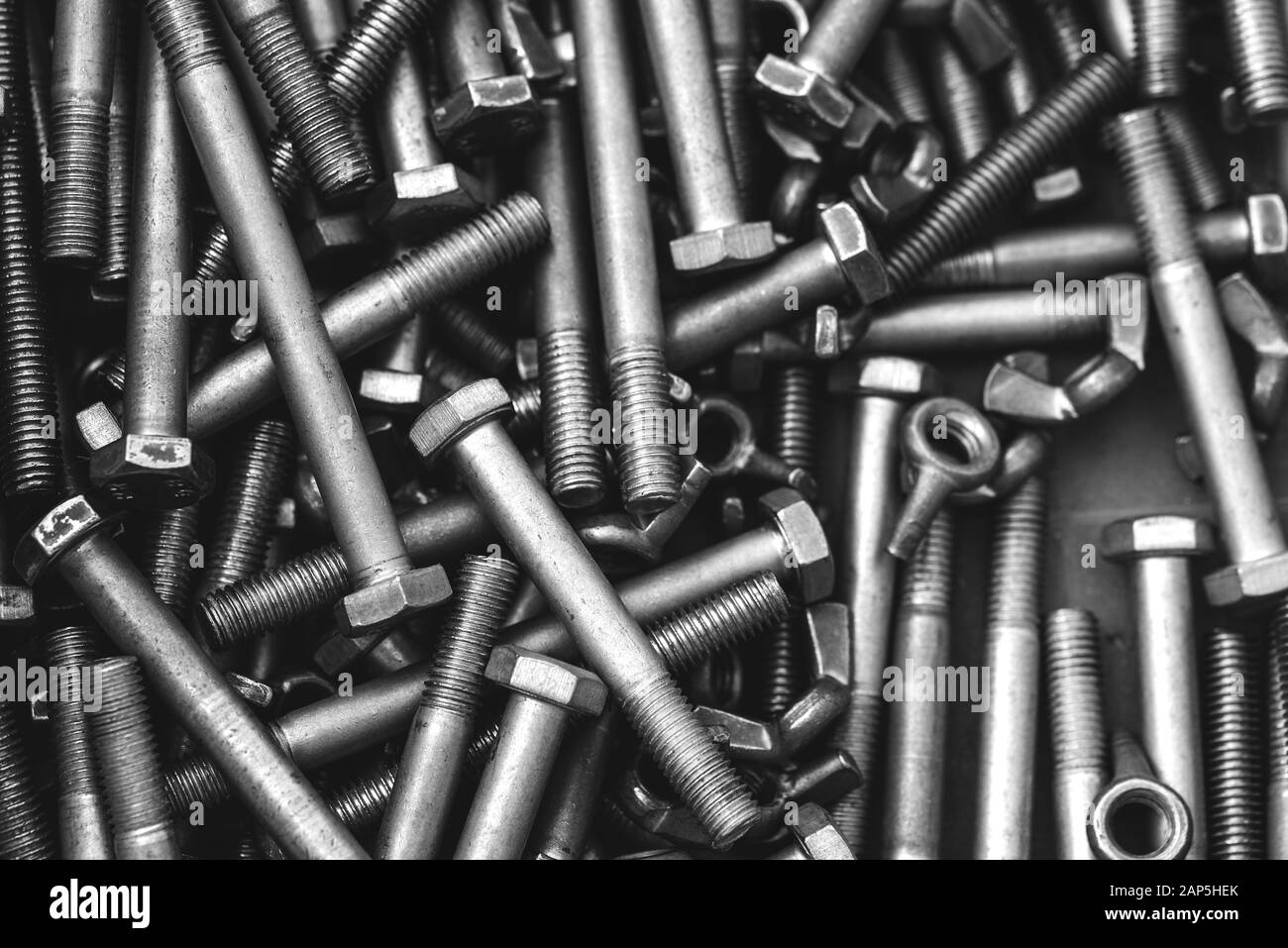 Long stainless steel bolts. Silver color metal parts. View from above Stock Photo