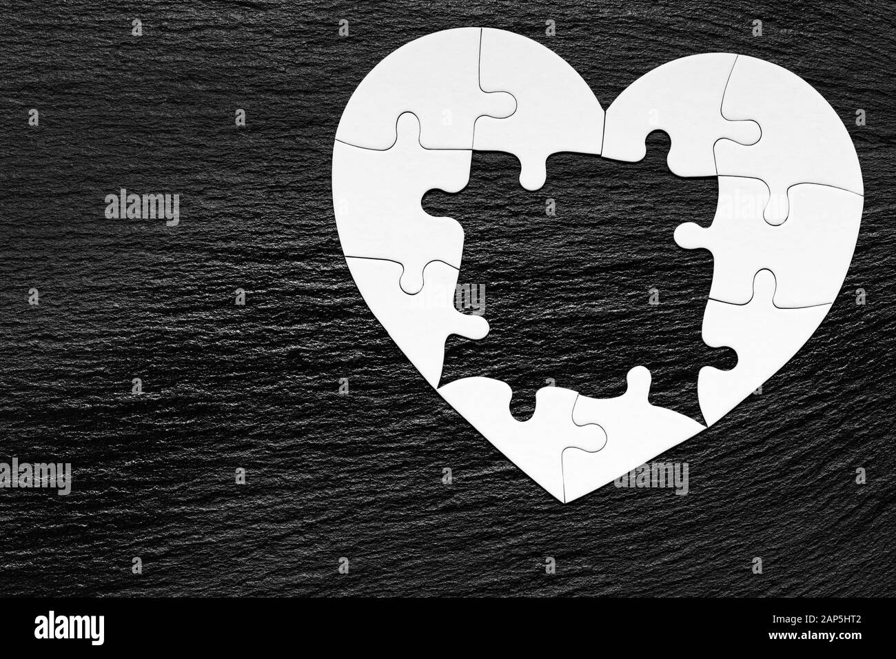 Heart puzzle Black and White Stock Photos & Images - Alamy
