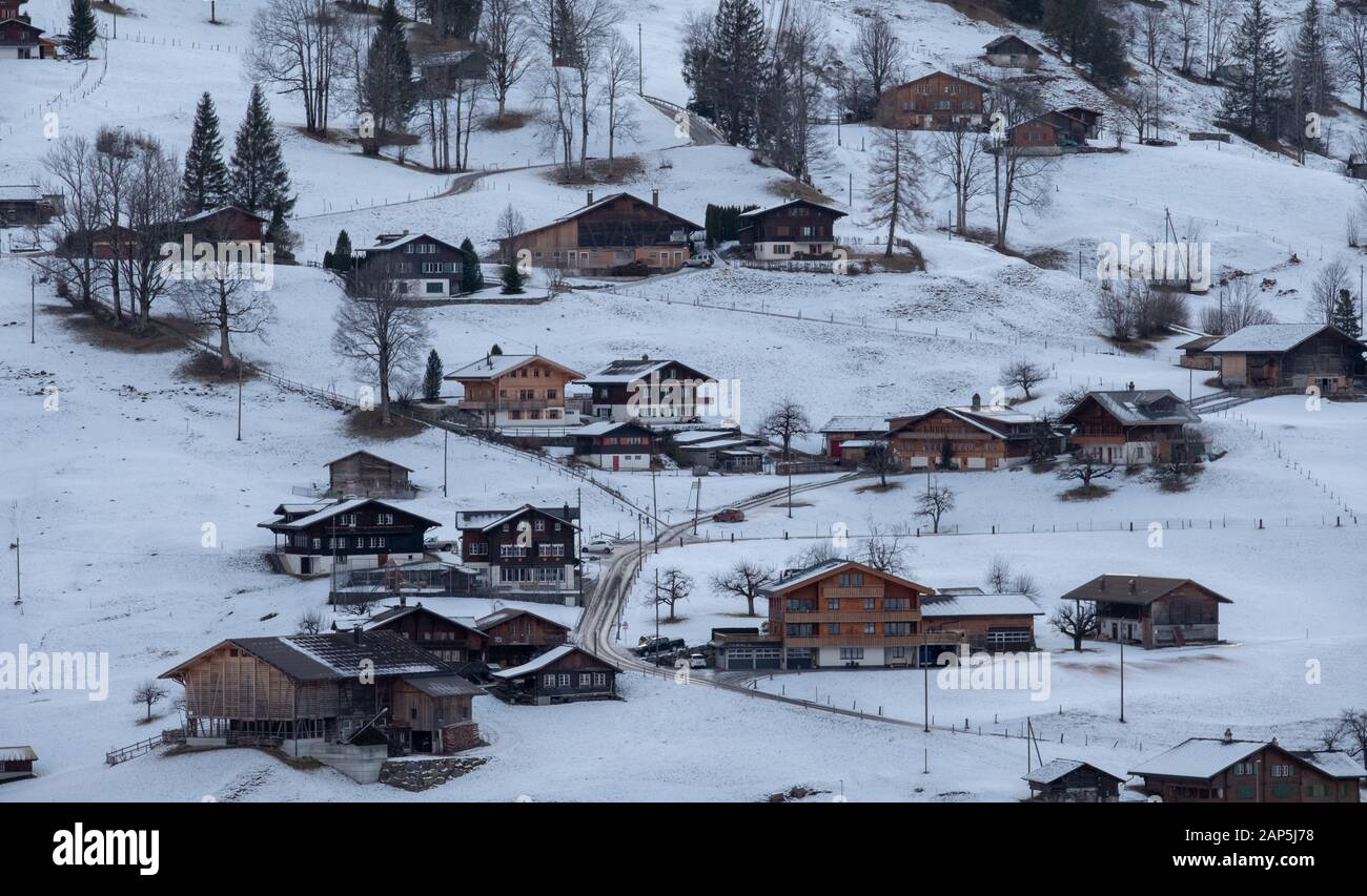 The Alpine village of Grindelwald, Switzerland, photographed at dusk in the snow in winter Stock