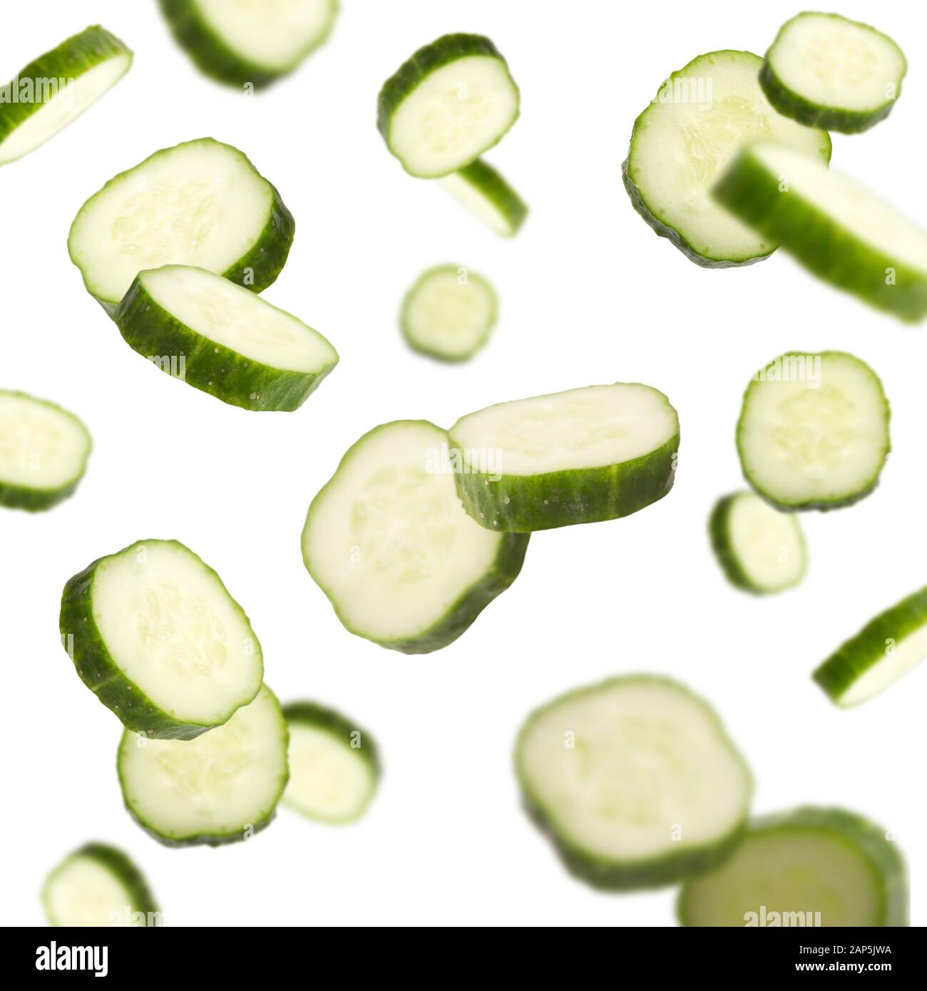 Flying fresh cucumbers dropping over white background Stock Photo Alamy