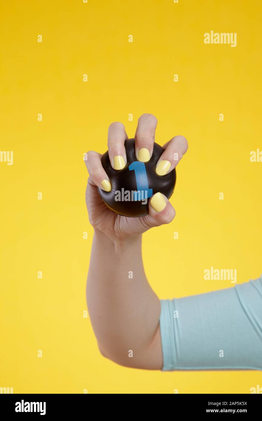 Hand Crushing stress ball Stock Photo Alamy