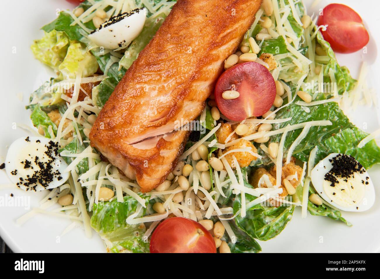 Grilled salmon caesar salad Stock Photo - Alamy