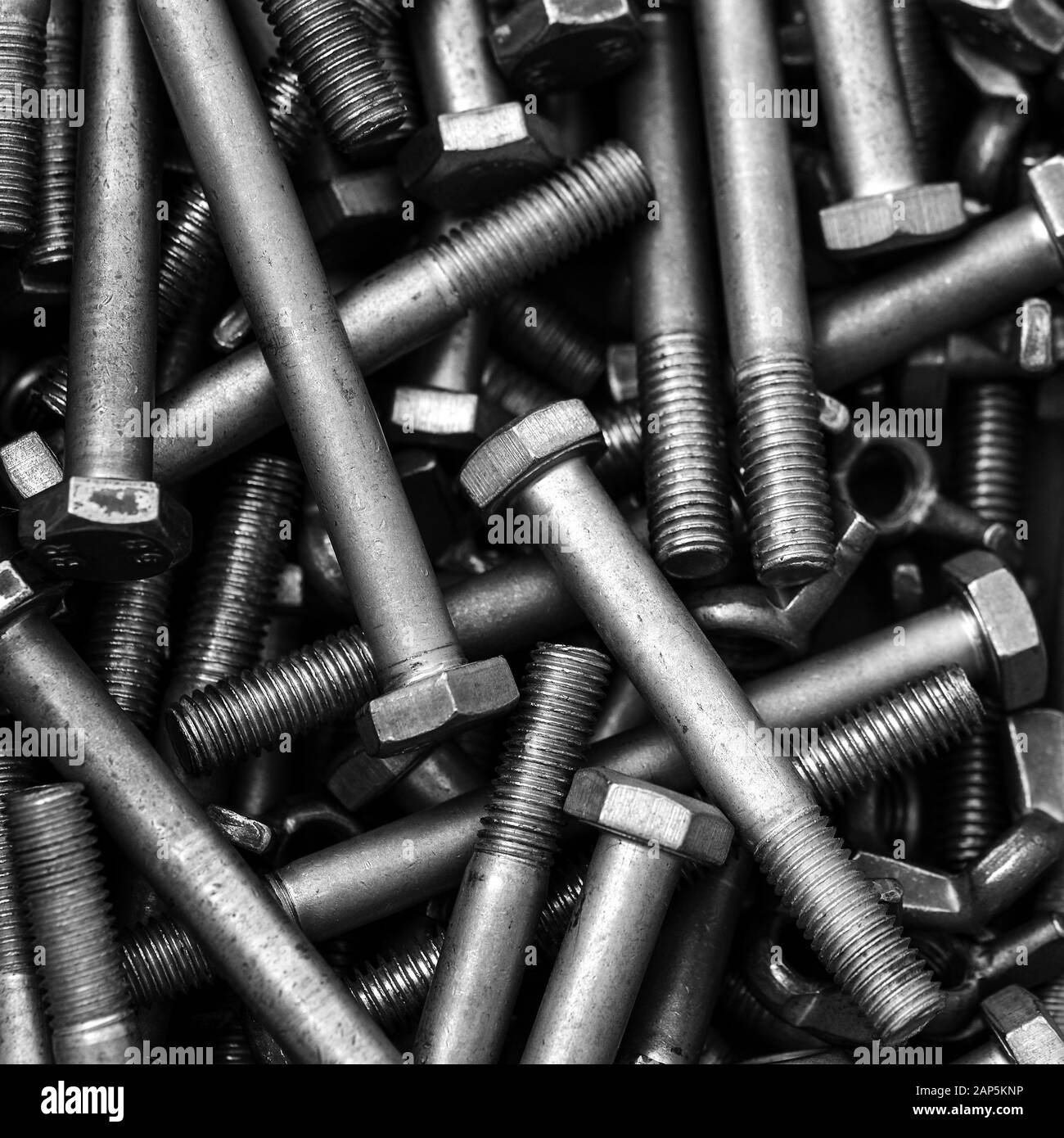 Bolts are steel. Elongated cylindrical products for fastening various structures and use in mechanical engineering, automotive industry Stock Photo