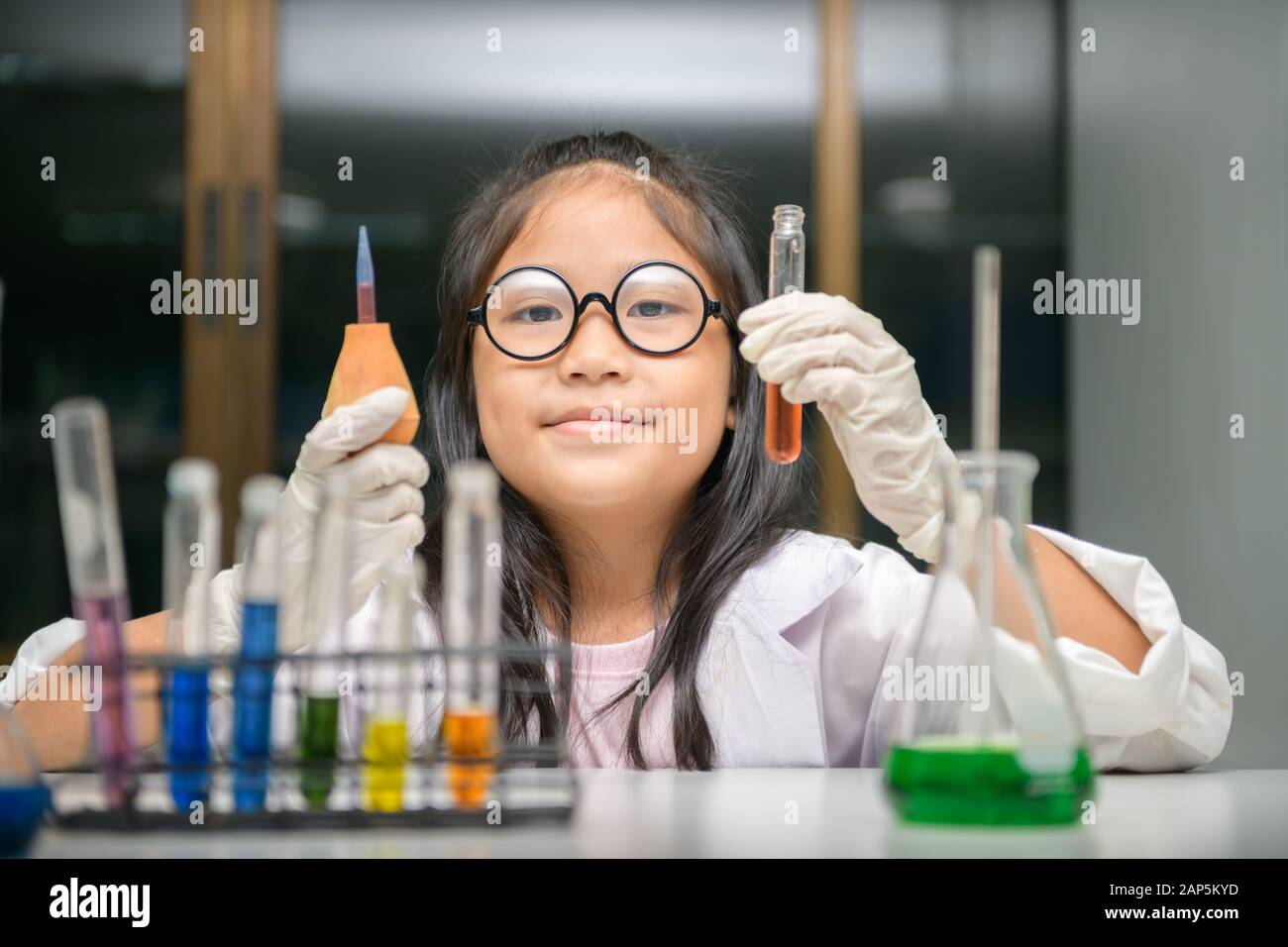 Little scientist use dropper to making experiment in chemical