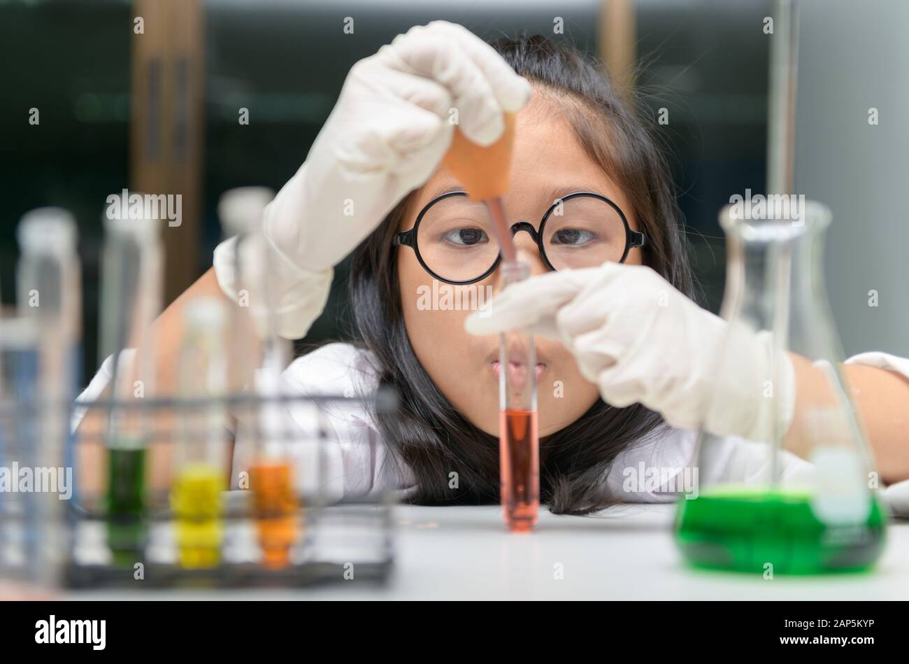 Little scientist use dropper to making experiment in chemical