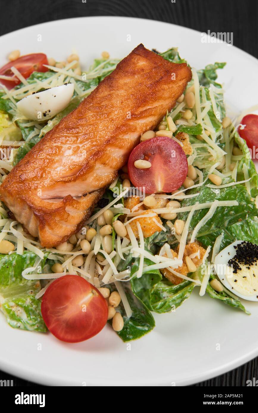 Grilled salmon caesar salad Stock Photo - Alamy