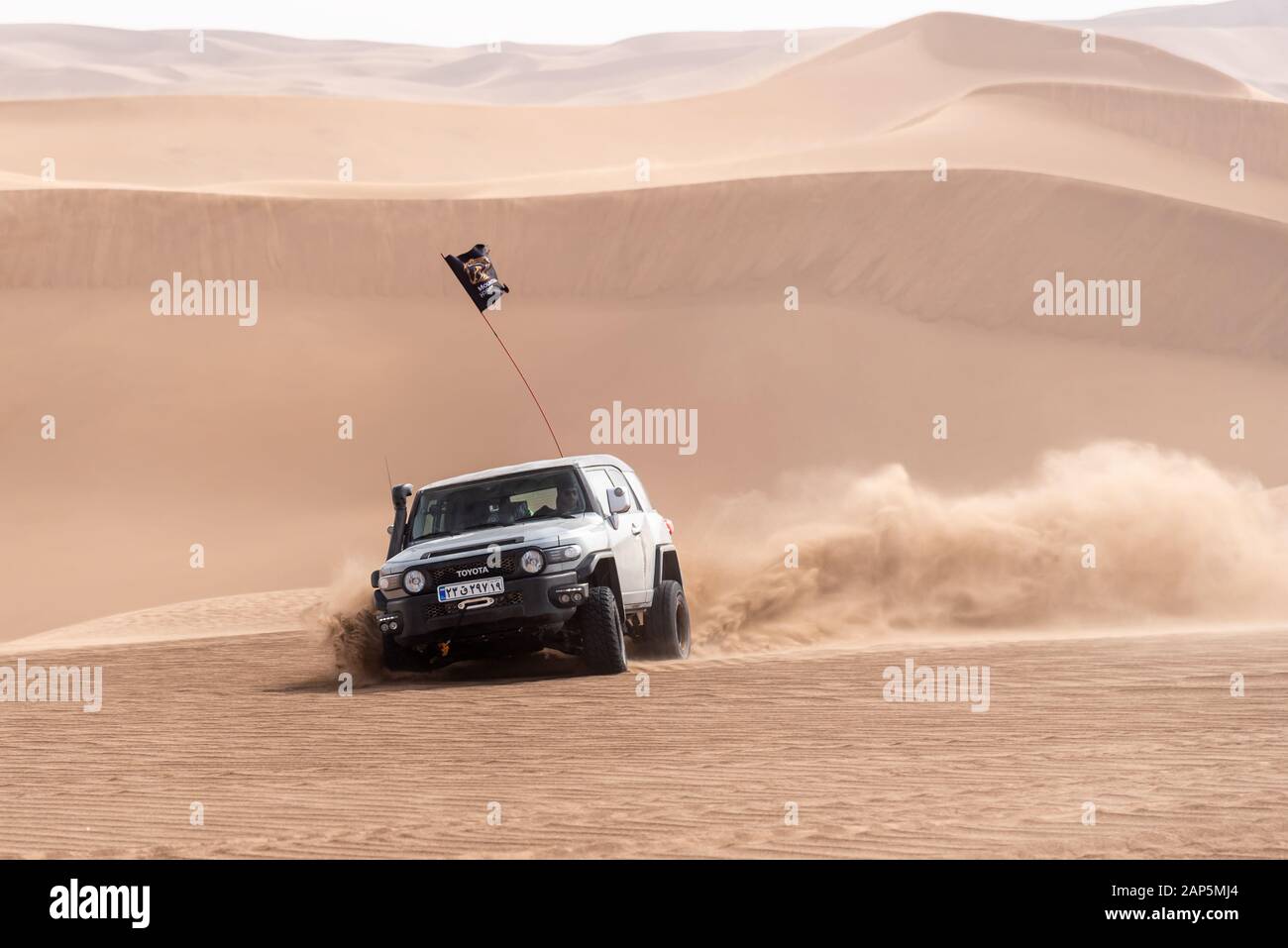 zahedan, baluchestan/iran-11/23/2018climbing sand dunes in Lut desert with a dakar edition race car Stock Photo
