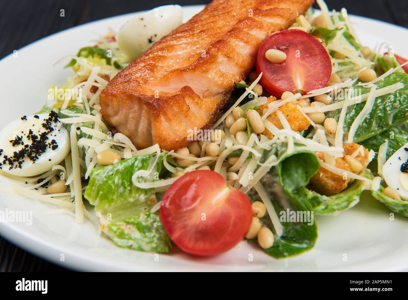 Grilled salmon caesar salad Stock Photo - Alamy