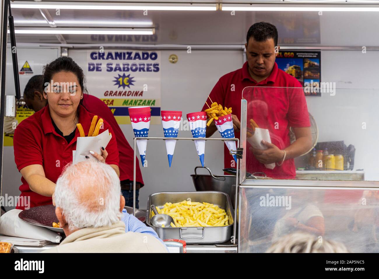 Selling churros to revellers at the San Sebastian fiesta from a fast