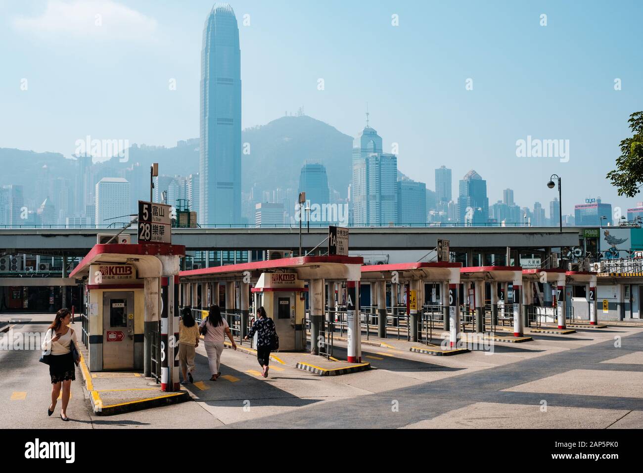 HongKong, China - November, 2019: Tsim Sha Tsui Bus terminal and skyline of Hong Kong Stock Photo