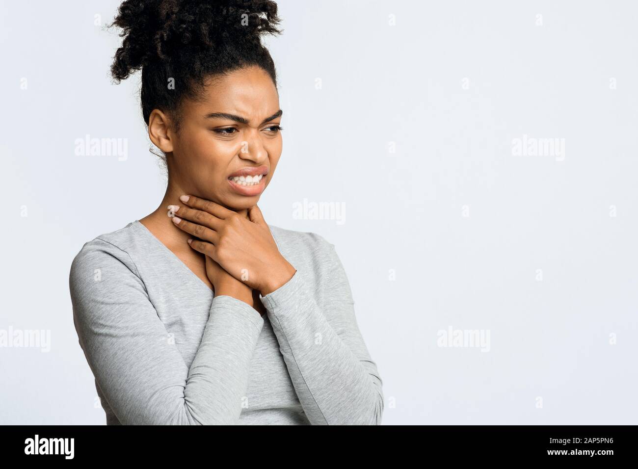 Girl touching neck hi-res stock photography and images - Alamy