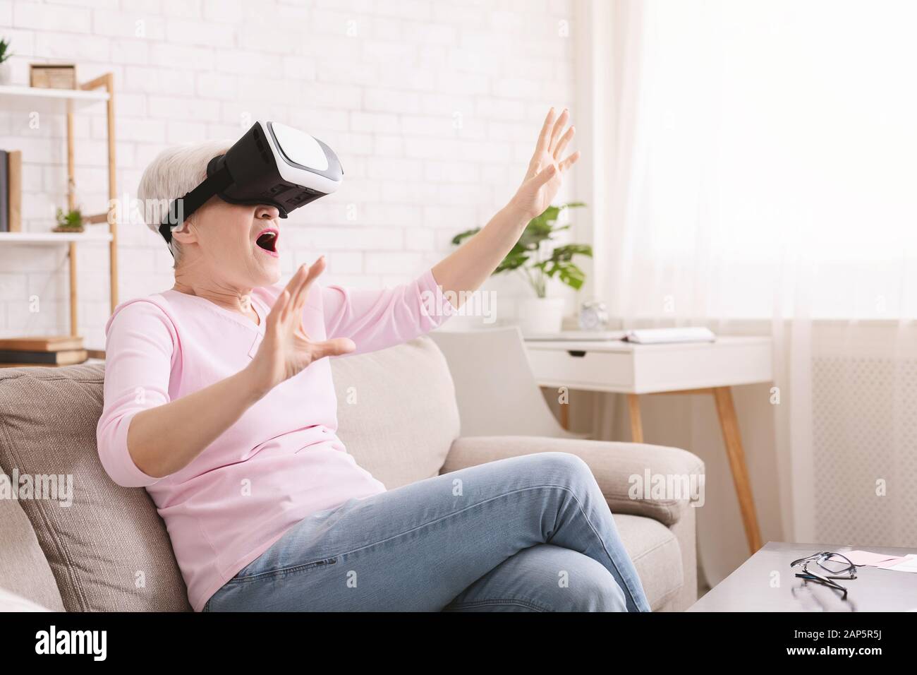 Old woman in virtual reality hi-res stock photography and images - Alamy